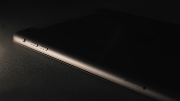 Close-up of a sleek, high-tech gadget with glowing interface elements.