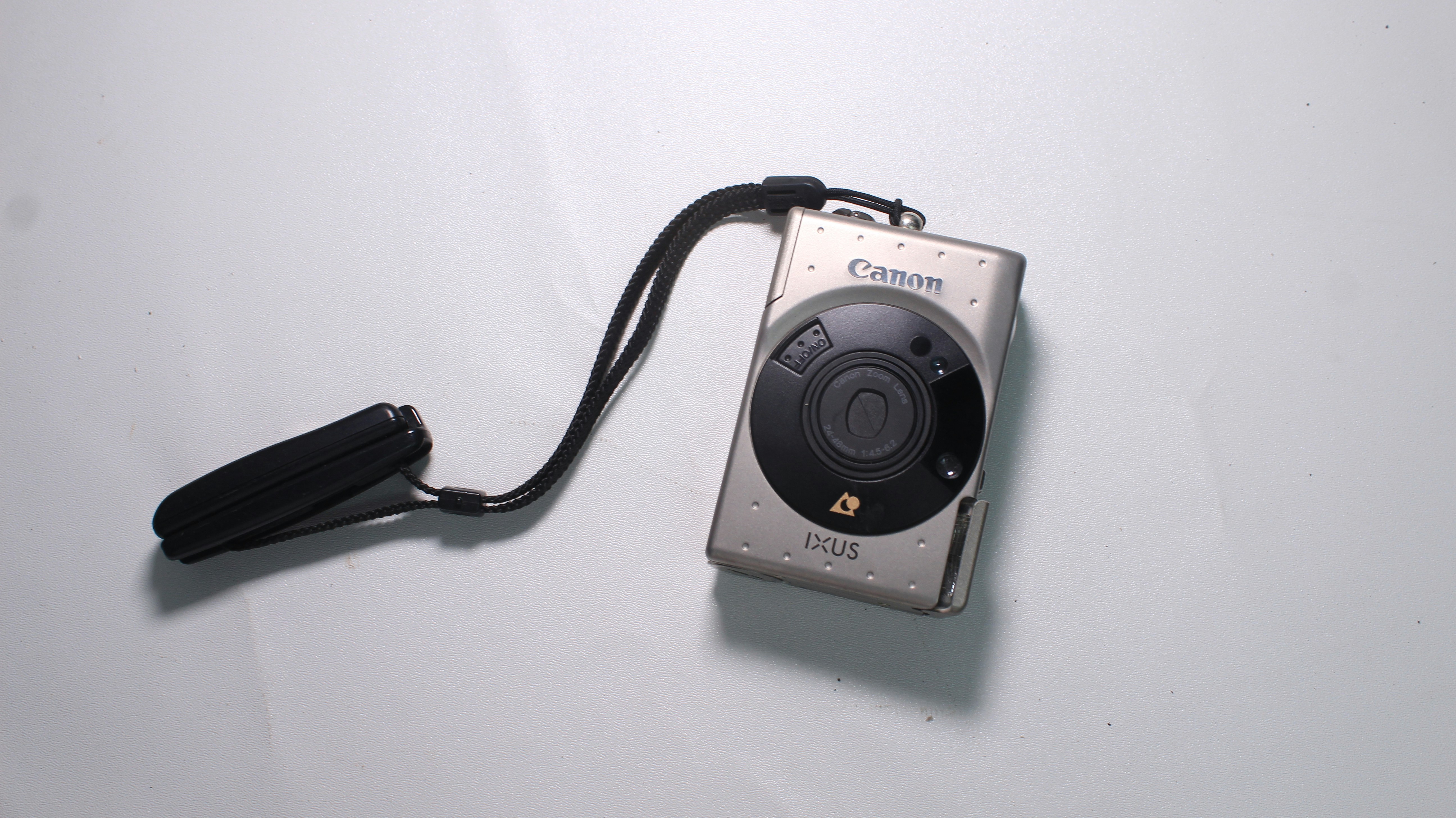 a digital camera sitting on top of a white table