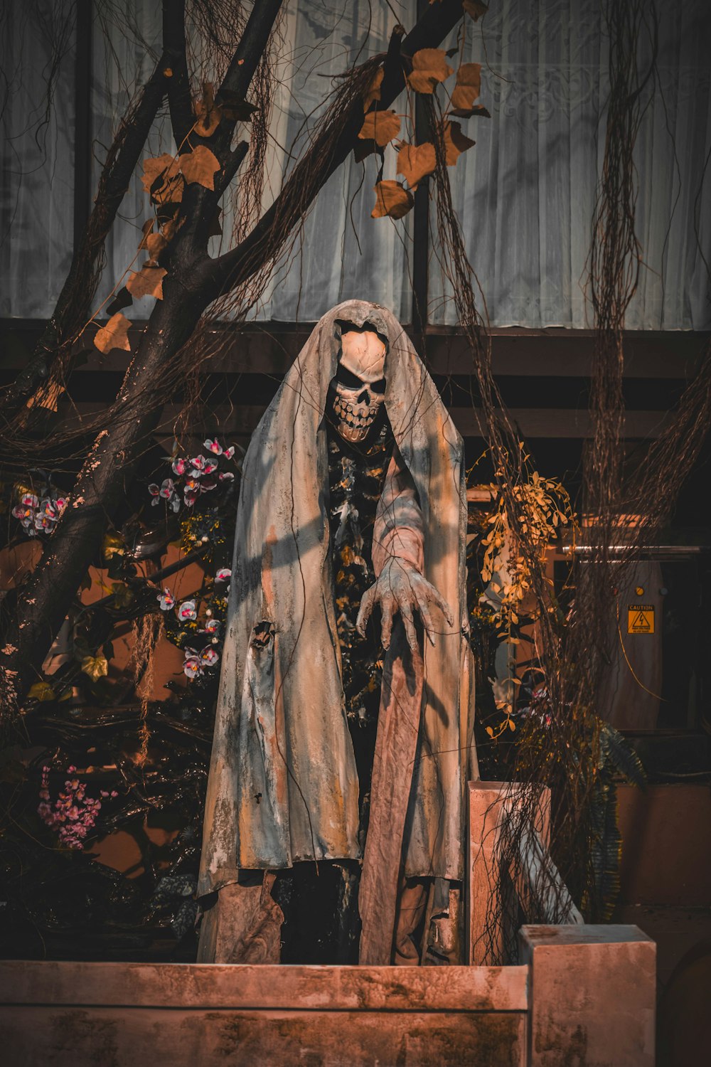 a statue of a skeleton dressed in a robe