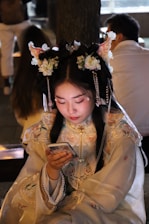 A stylish young Asian model engaging with a smartphone, vibrant social media icons around.