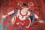 A vibrant mural depicting traditional Indian motifs and patterns.