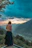A happy traveler standing on a scenic mountain overlook during sunset.