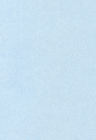 an airplane is flying in the sky on a clear day