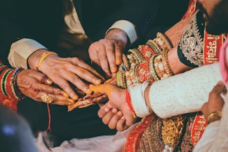 a group of people holding hands with each other