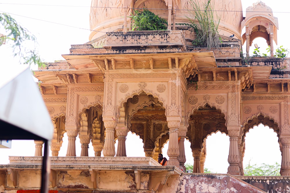 an ornate building with a bird perched on top of it