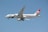 A large commercial airplane with the Biman Bangladesh airlines livery on a clear day. The aircraft is in mid-flight, showcasing its sleek design and the airline's distinctive red and green logo on the tail.