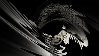 An abstract and fluid design with a central spiral feature, showing an interplay of light and shadow in curving shapes. The image has a metallic sheen and features reflections giving it a dynamic and futuristic look.