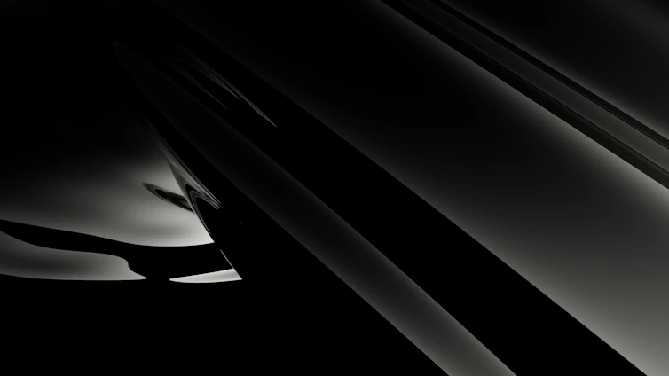 A sleek black and white abstract pattern blending sharp lines and soft curves.