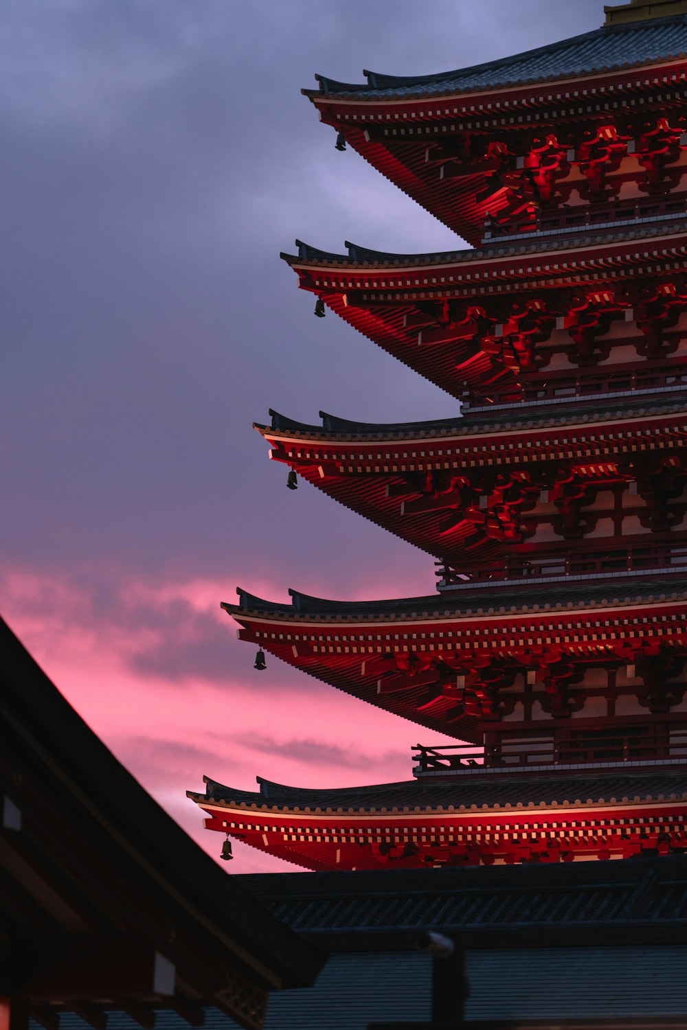 a tall building with a sky in the background