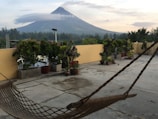 Warm terrace with heated pool overlooking the snow-capped Villarrica volcano at sunset