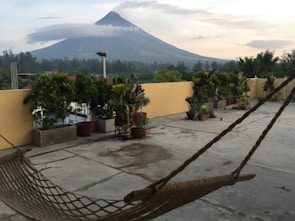 Warm terrace with heated pool overlooking the snow-capped Villarrica volcano at sunset