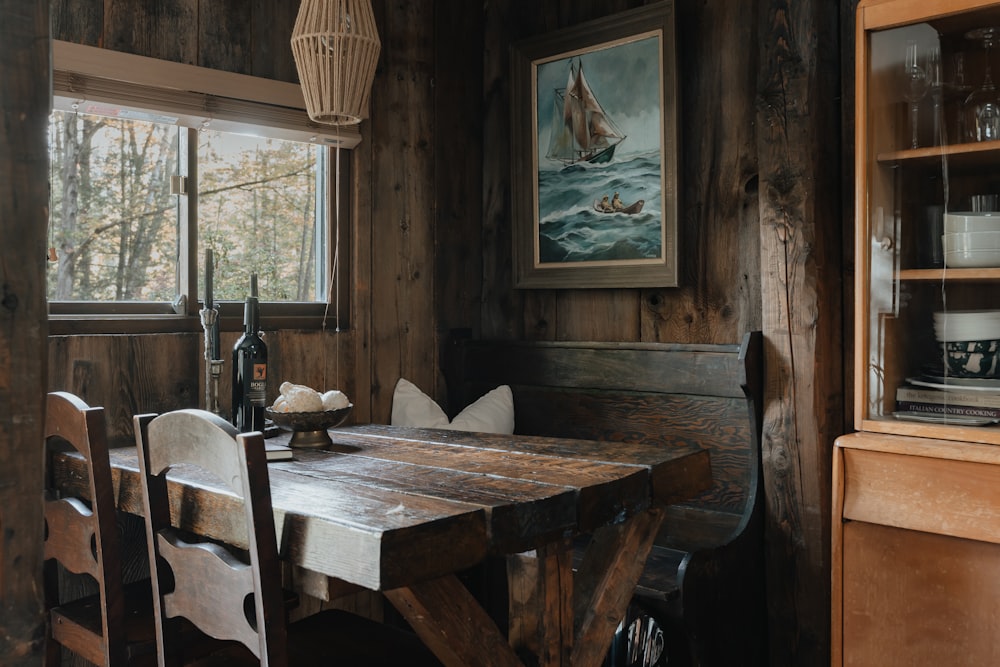 a wooden table and chairs in a room