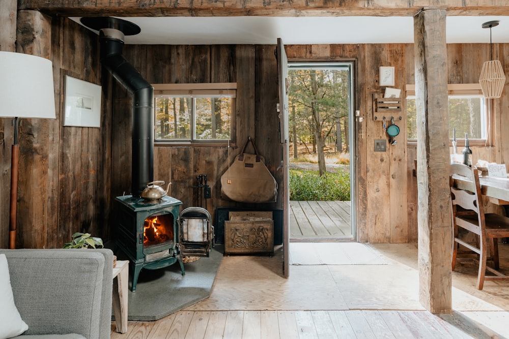 a living room with a wood stove inside of it