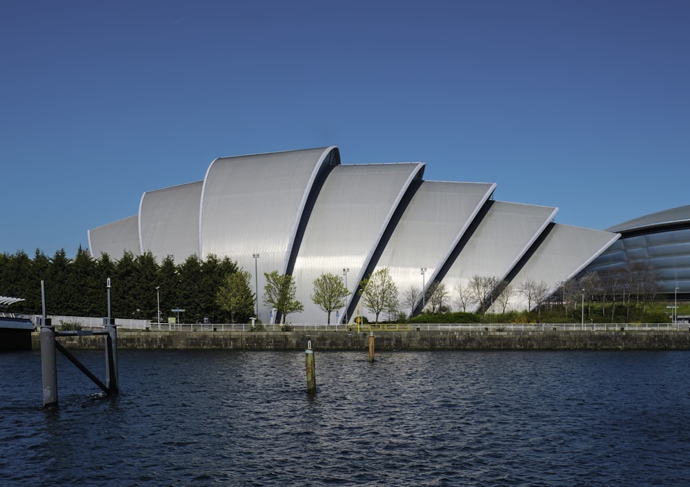 a large building sitting next to a body of water