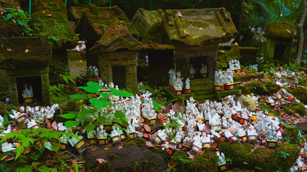 a group of small figurines in a forest setting