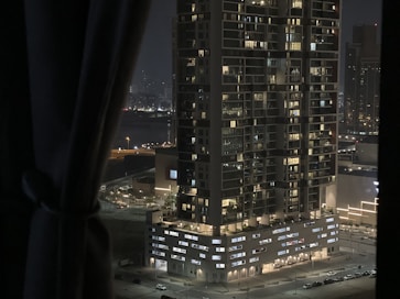 Night view of a high-rise building with illuminated windows