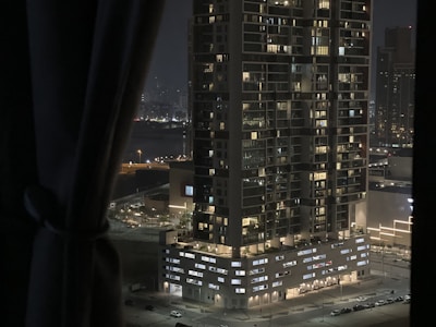 Night view of a high-rise building with illuminated windows