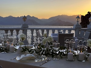 A beautifully set dining table overlooking the lake.
