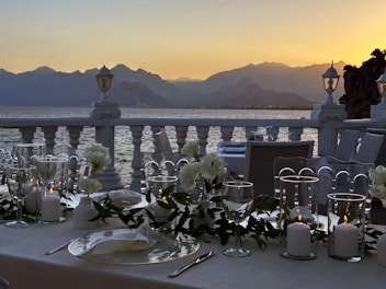 A beautifully set dining table at the rooftop restaurant with panoramic views of Varanasi.
