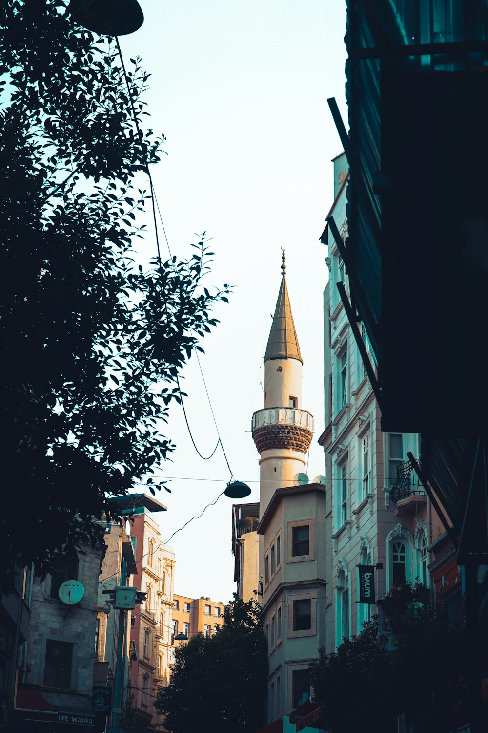 a view of a building with a tower in the background