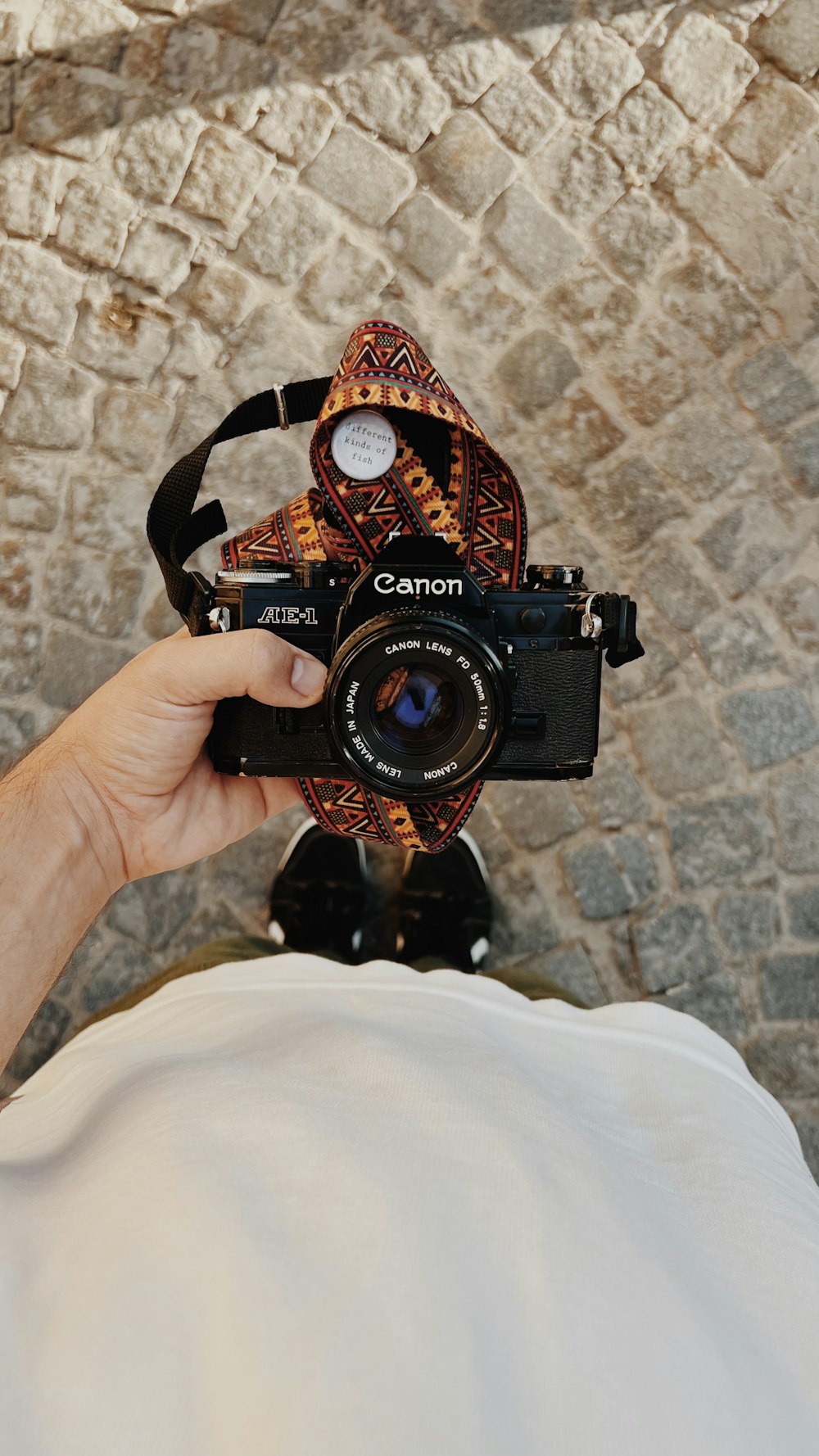 a person holding a camera up to their face