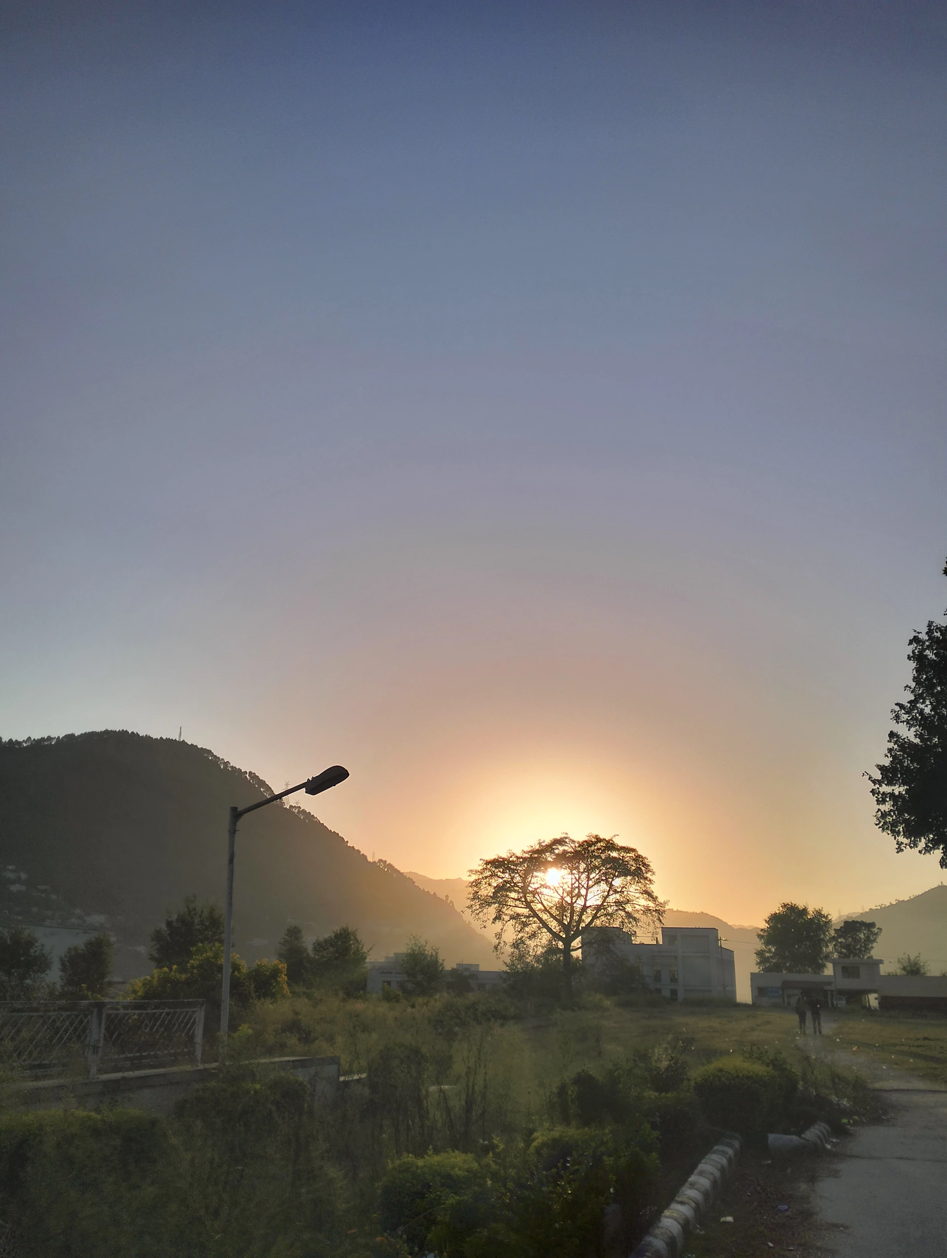 A serene morning scene of a quiet street bathed in soft sunlight, symbolizing the calm moments amidst life's uncertainties.