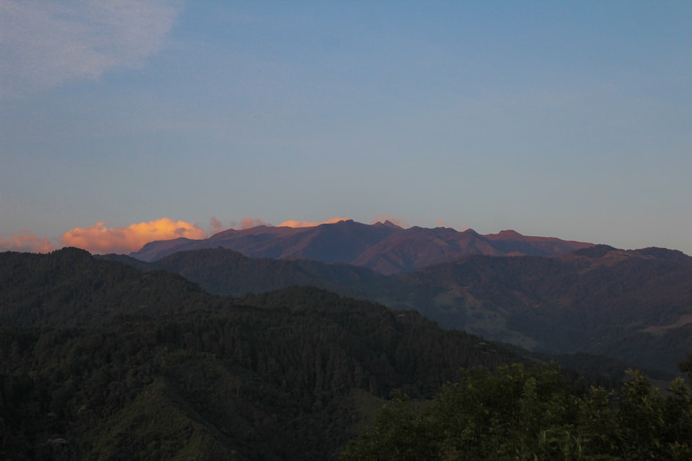 a view of a mountain range at sunset