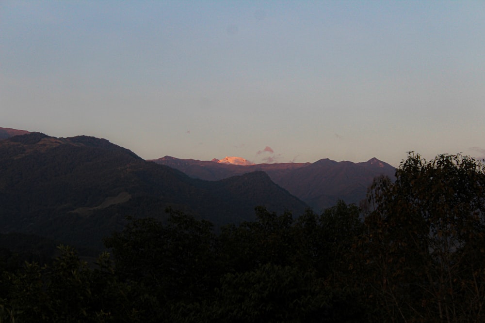 a view of a mountain range at sunset