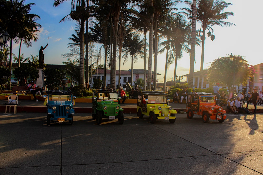 a group of children's vehicles parked on the side of a road