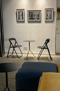 A compact foldable table neatly tucked against a wall in a modern apartment.