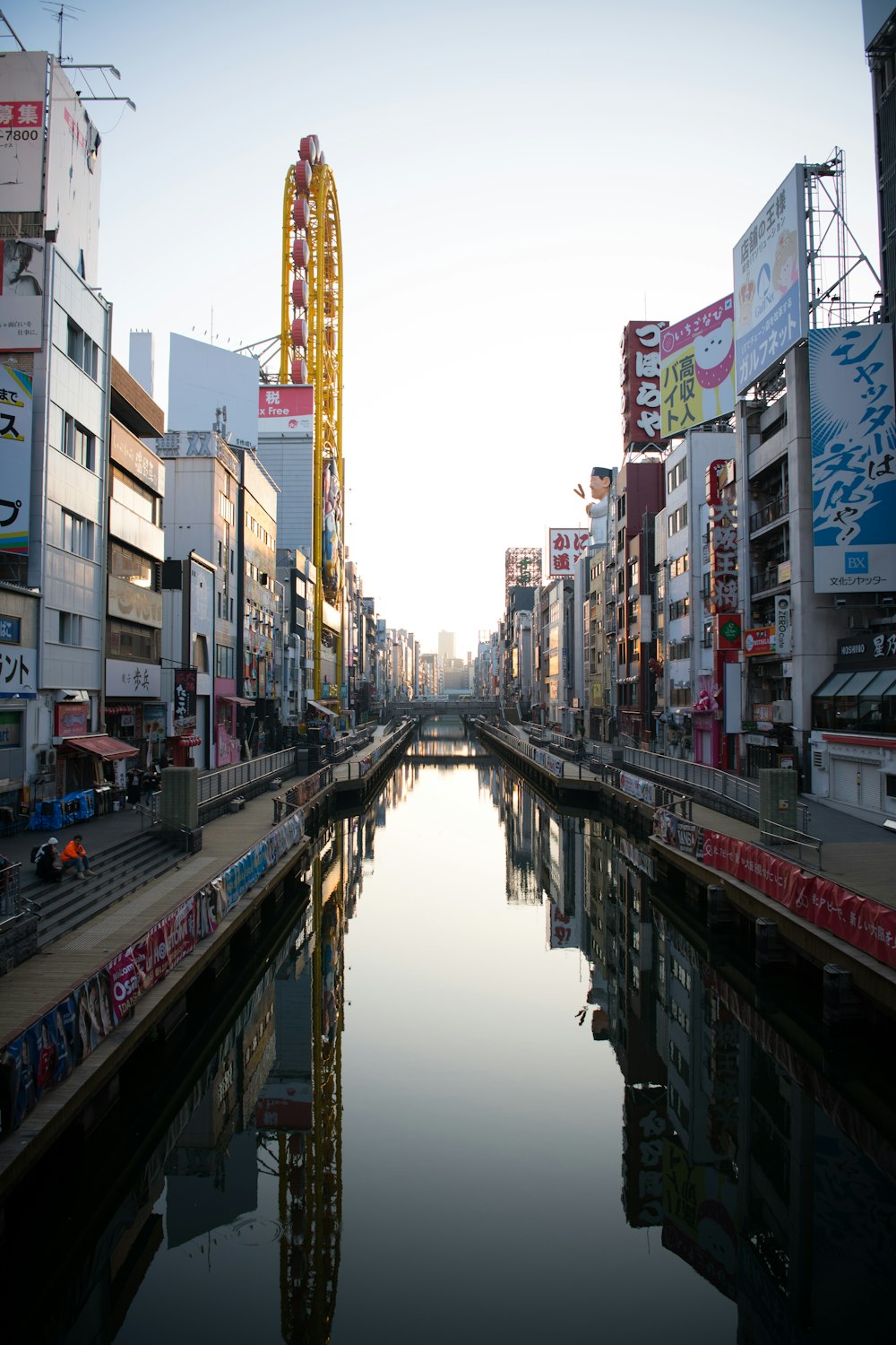 a river running through a city next to tall buildings