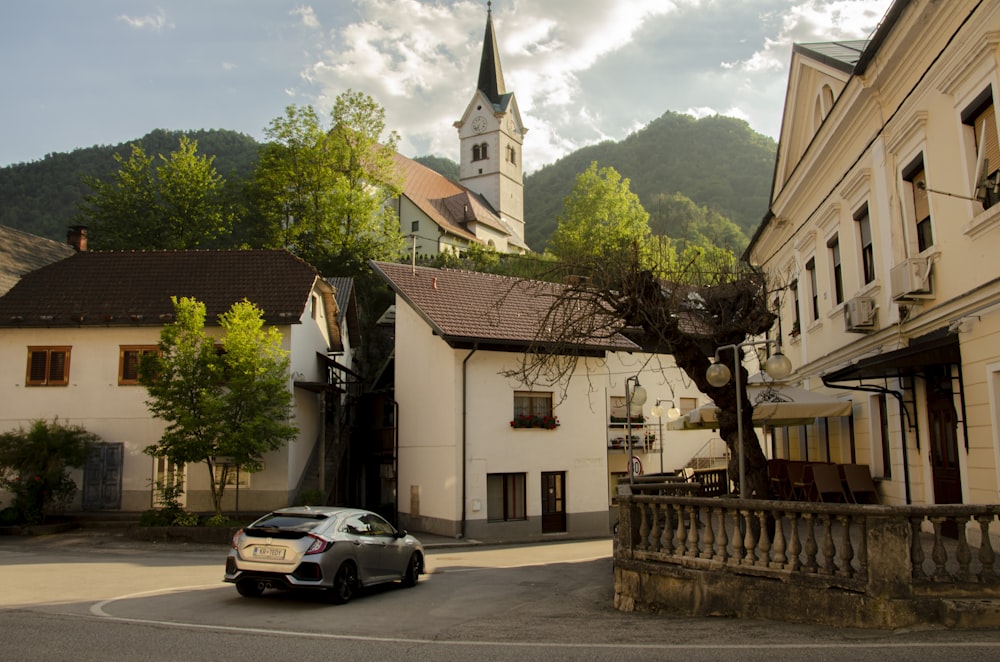 a car is parked in front of a church