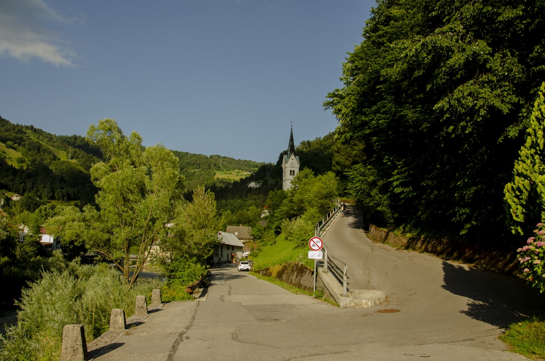 a road with a church in the background,