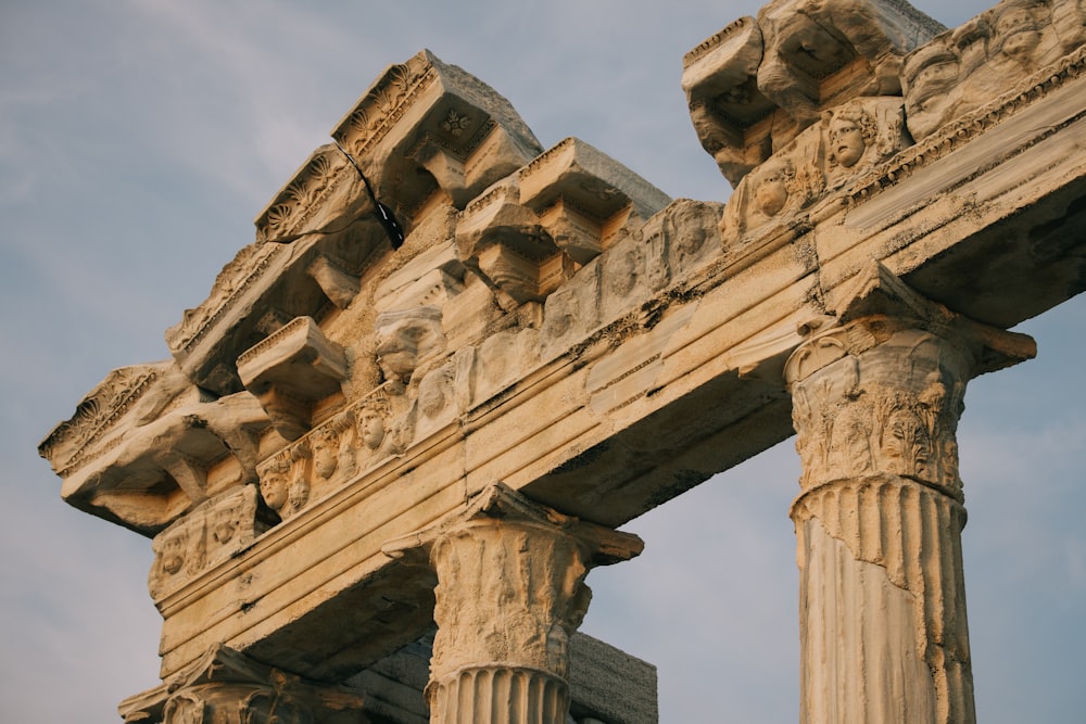 a close up of a stone structure with columns