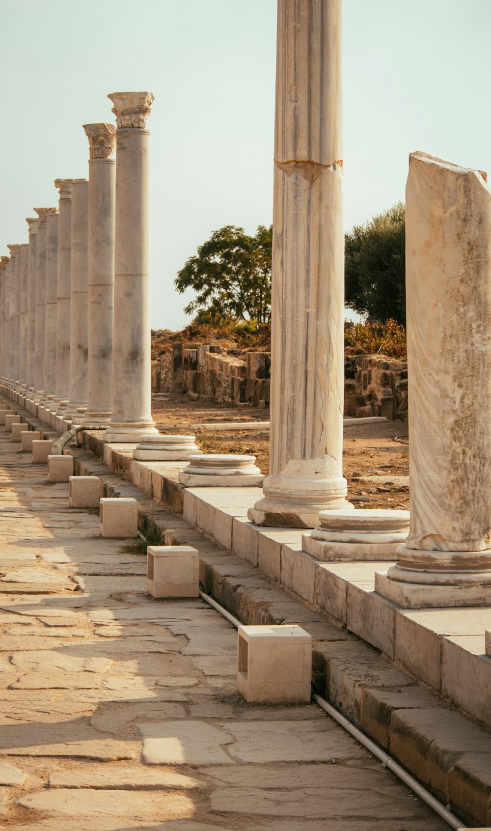 a row of stone pillars sitting next to each other