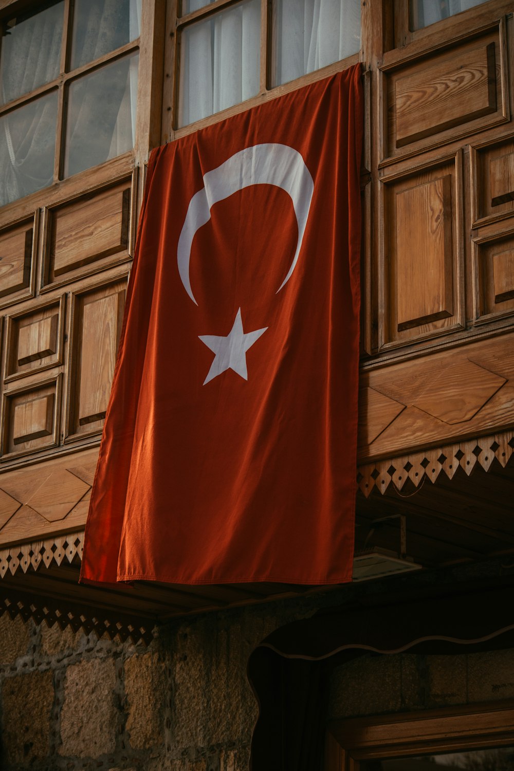 a turkey flag hanging from the side of a building