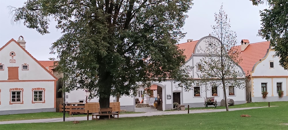 a couple of white houses sitting next to each other