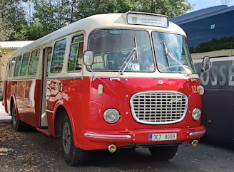 A modern bus ready for rental in a scenic location.
