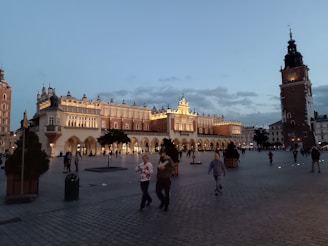 A panoramic view of Kraków's historic market square bustling with tourists.