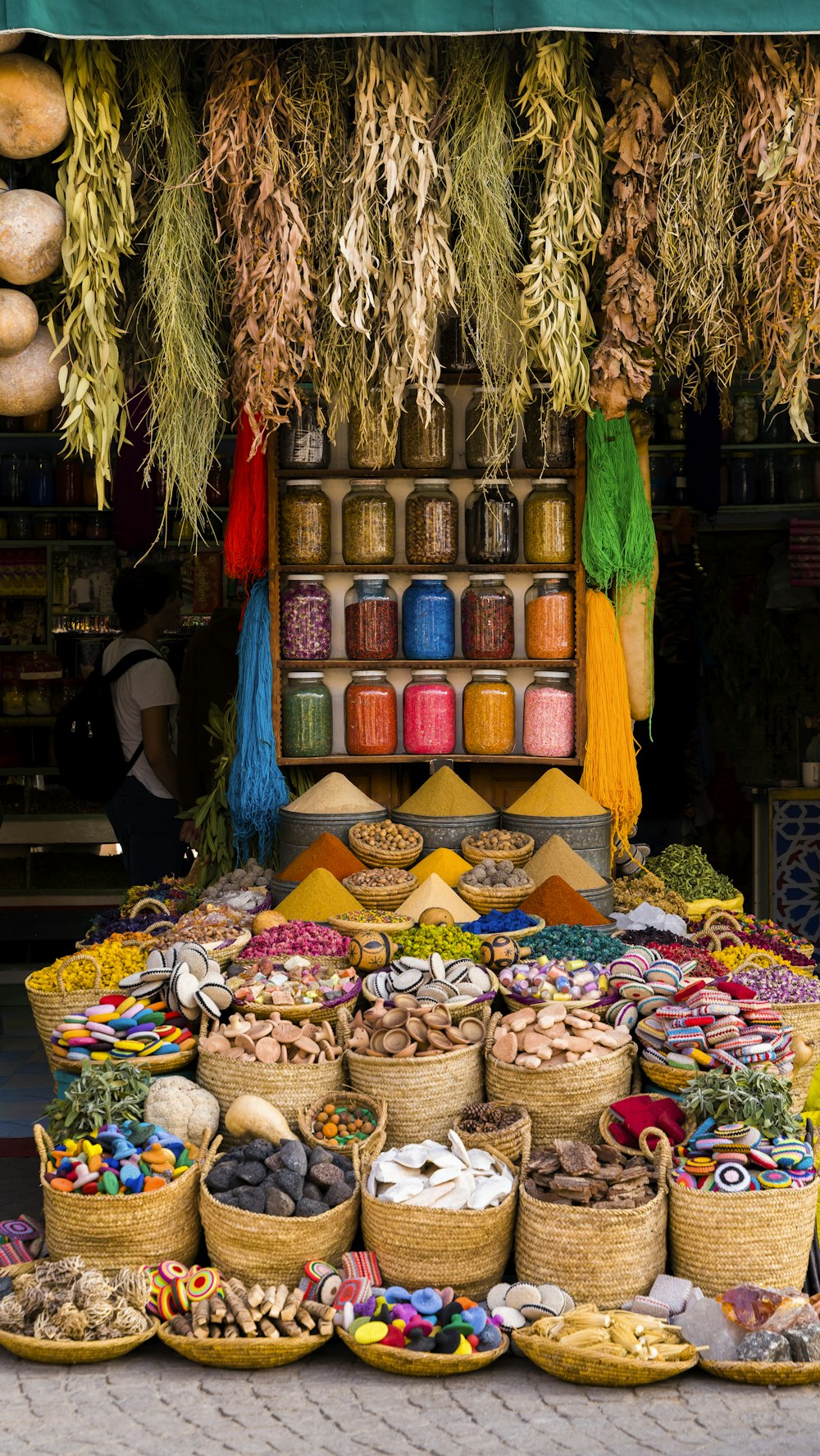 a market with baskets of food on display