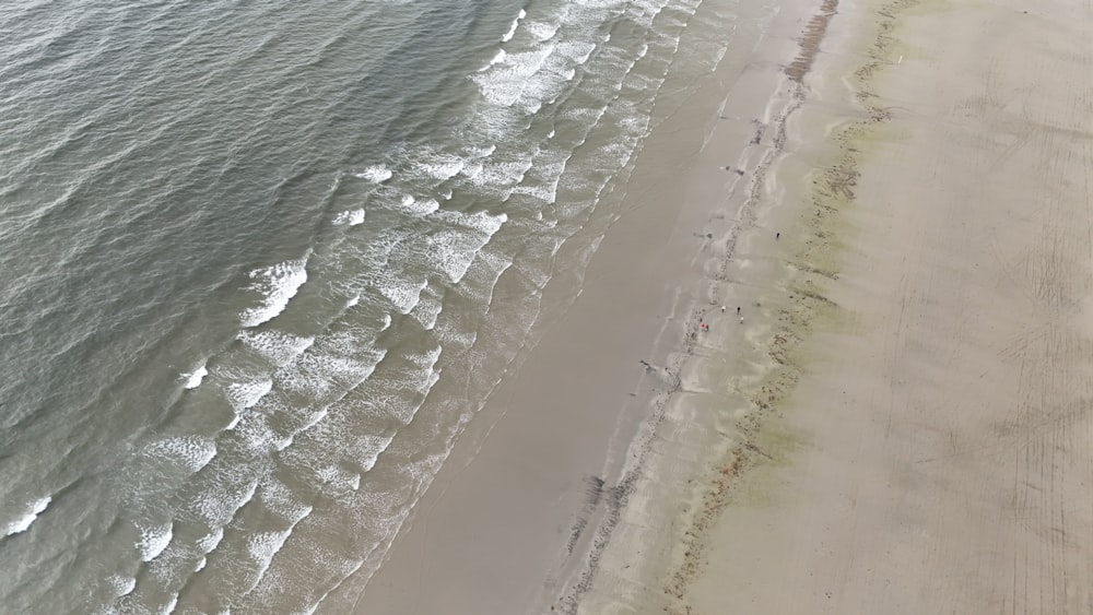 an aerial view of a beach and ocean