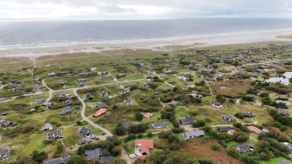 an aerial view of a neighborhood by the beach