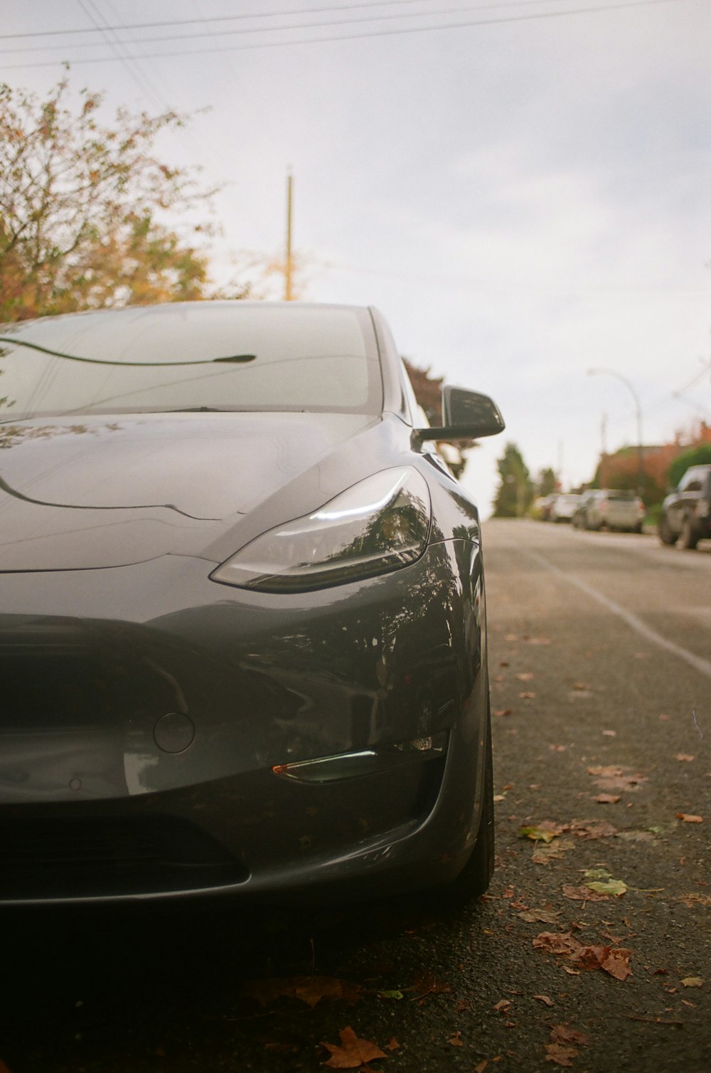 a black sports car parked on the side of the road