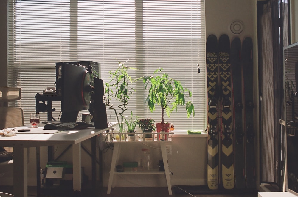 a room with a desk and a large window