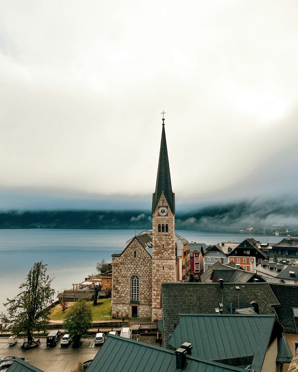 a church with a steeple on a cloudy day