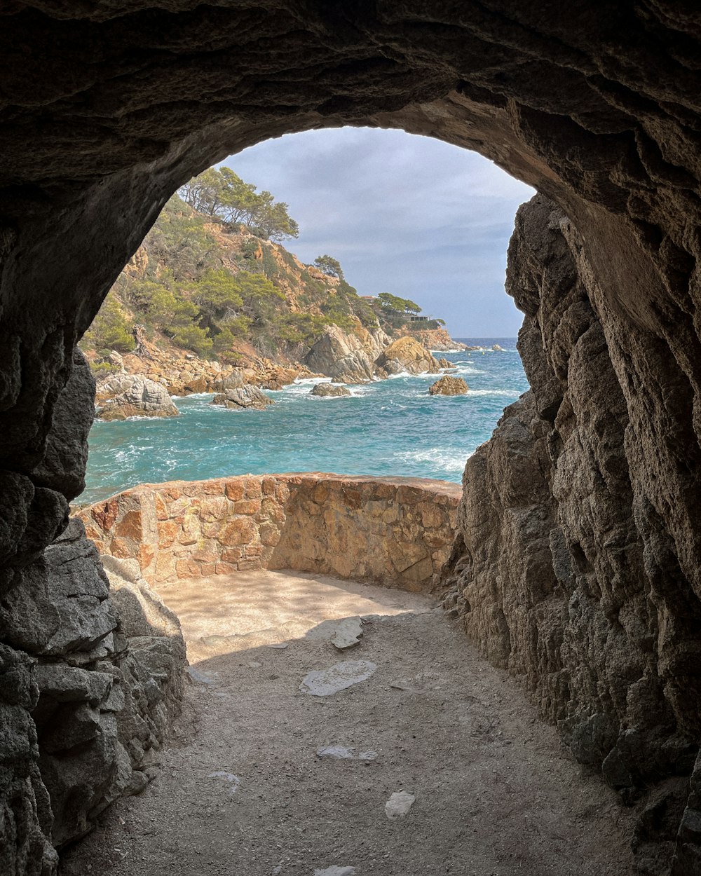 a view of the ocean from inside a cave