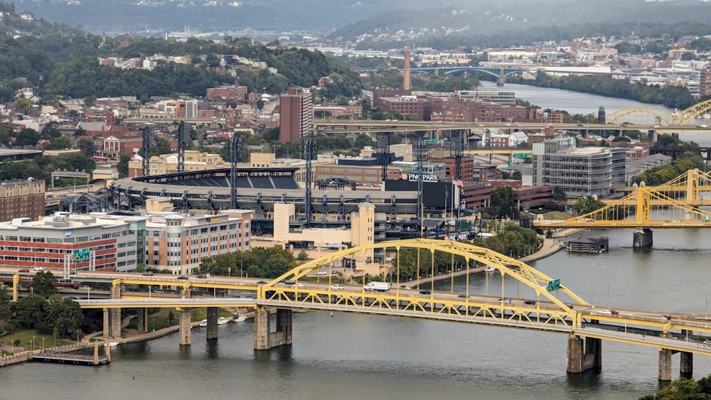 a view of a bridge over a river with a city in the background