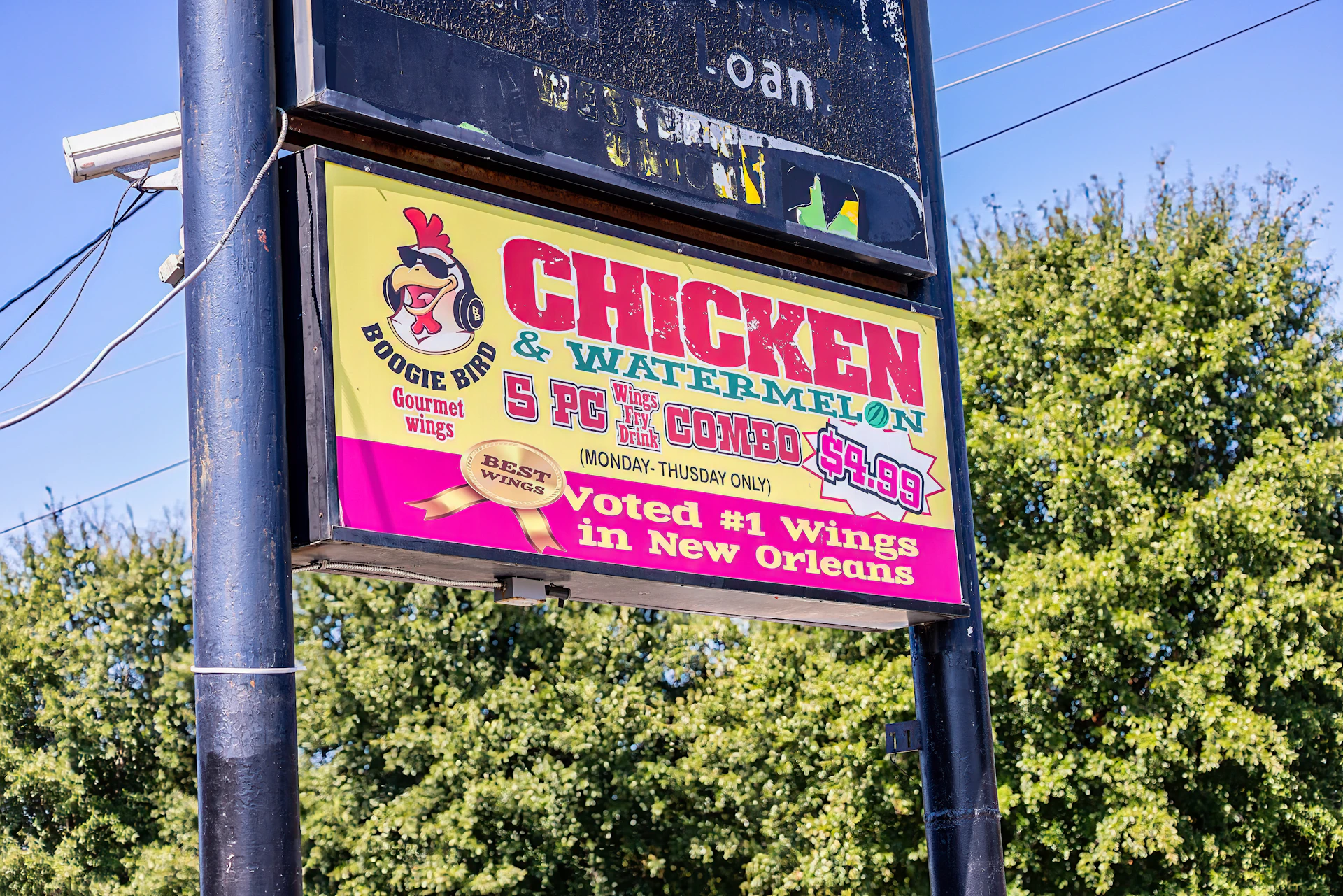 a sign for a chicken and watermelon restaurant