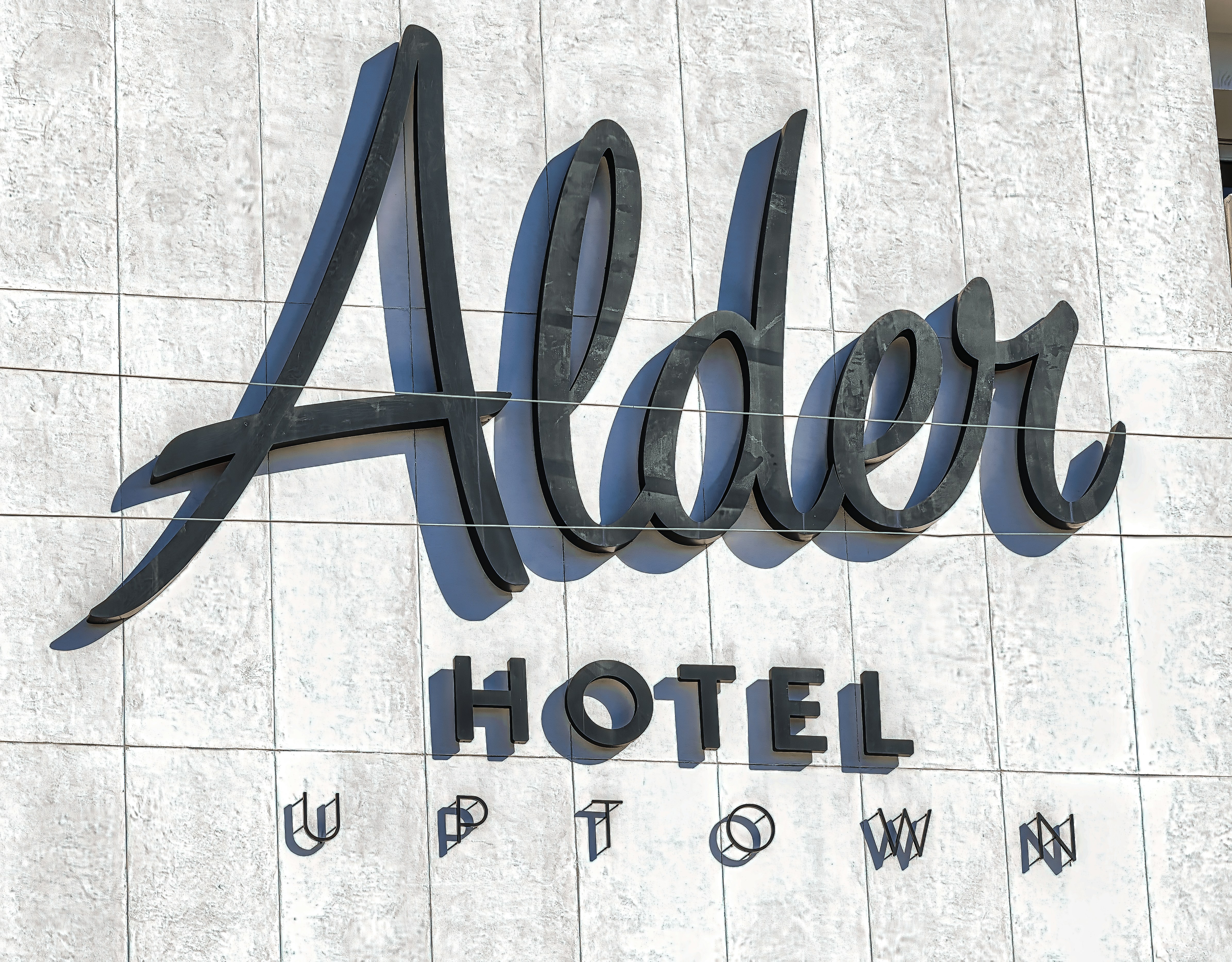 a hotel sign on the side of a building