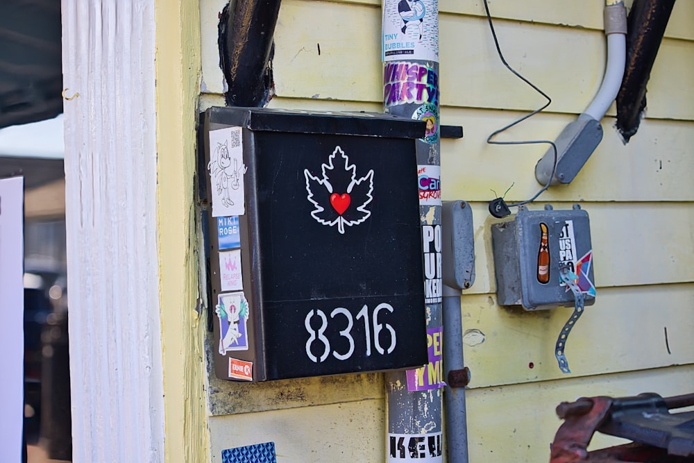 a sign on the side of a building with a maple leaf on it